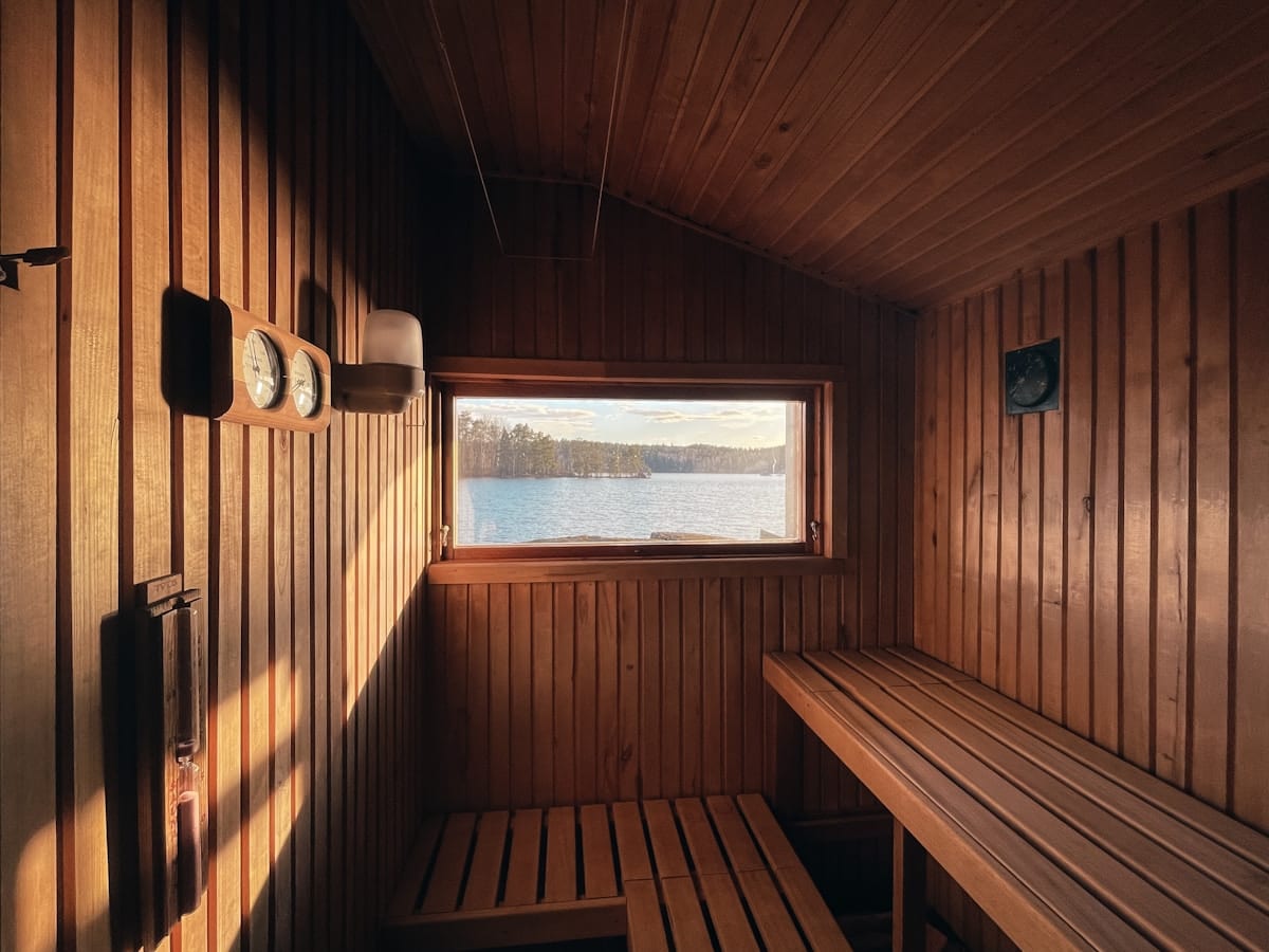 Cedar dry sauna interior with warm amber glow